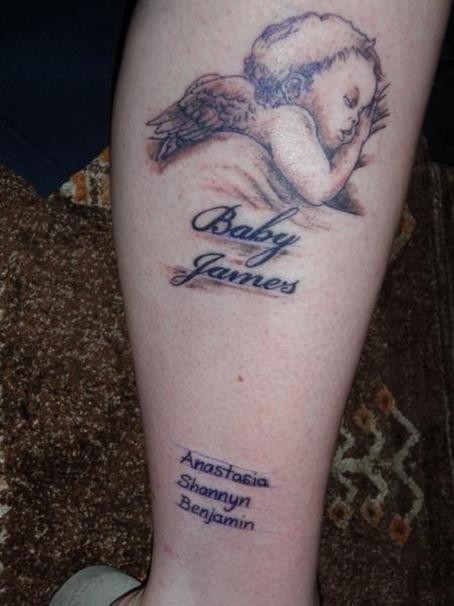 点击大图看下一张：小腿可爱的小天使纹身图案