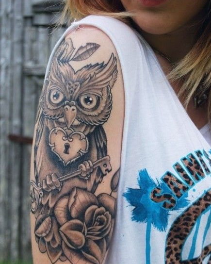点击大图看下一张：手臂个性猫头鹰纹身