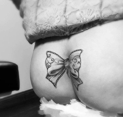 点击大图看下一张：精美的蝴蝶结纹身图案