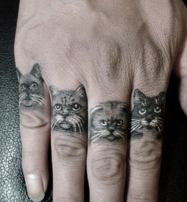 点击大图看下一张：手指上各种可爱的小猫纹身
