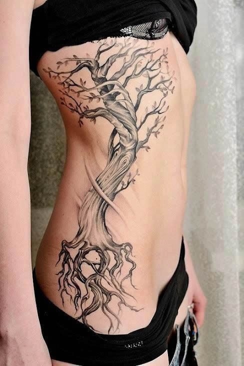 点击大图看下一张：美女腰部独特的树纹身