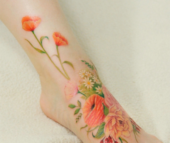 点击大图看下一张：一组非常美观的漂亮花朵纹身刺青
