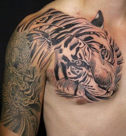 点击大图看下一张：凶猛霸气的老虎半甲纹身