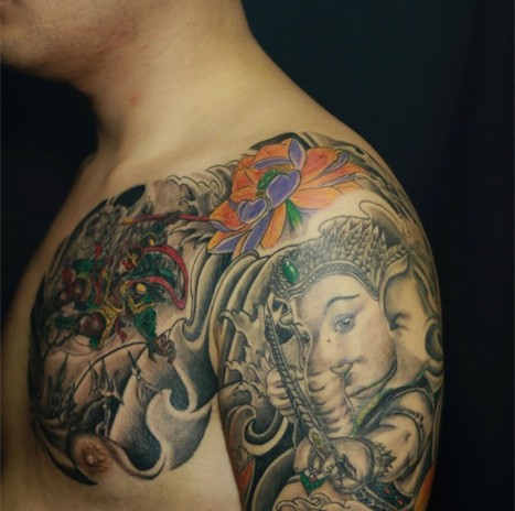 点击大图看下一张：超流行经典的半甲象神纹身