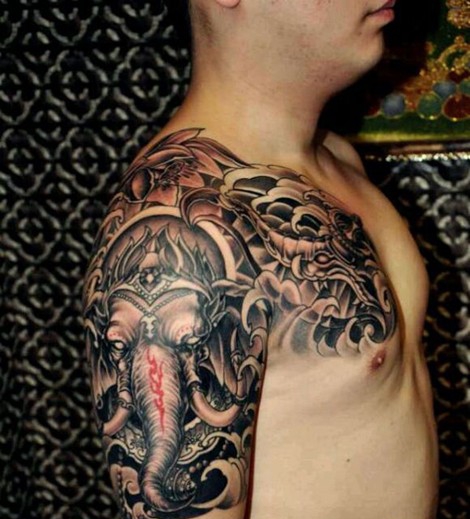 点击大图看下一张：超流行经典的半甲象神纹身