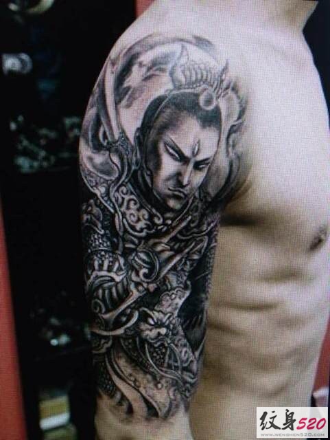 点击大图看下一张：手臂大臂上个性霸气的二郎神杨戬纹身图案