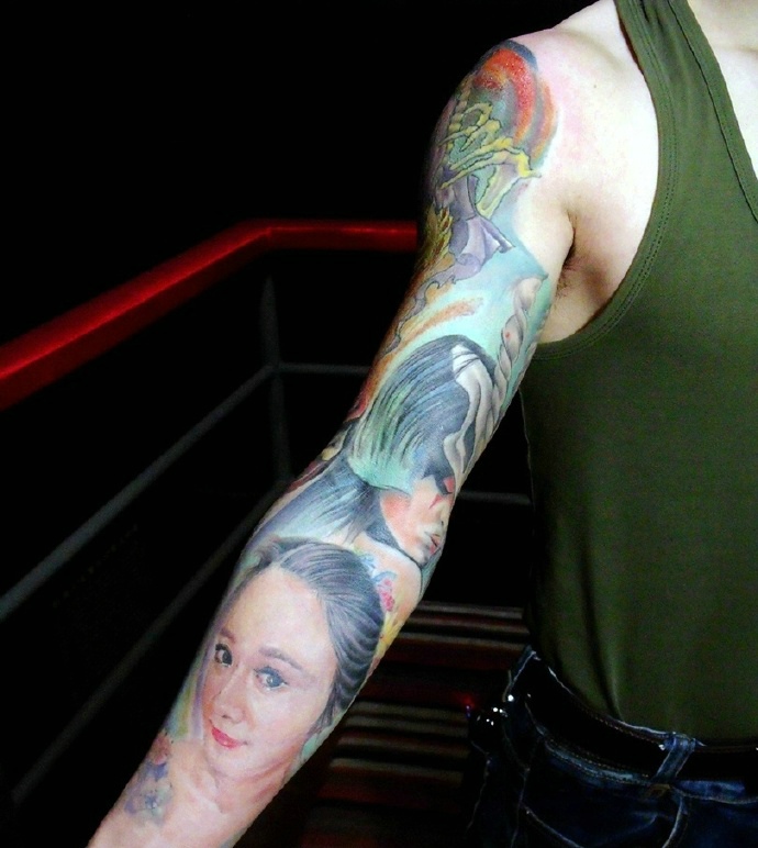点击大图看下一张：精致好看的花臂图腾纹身刺青
