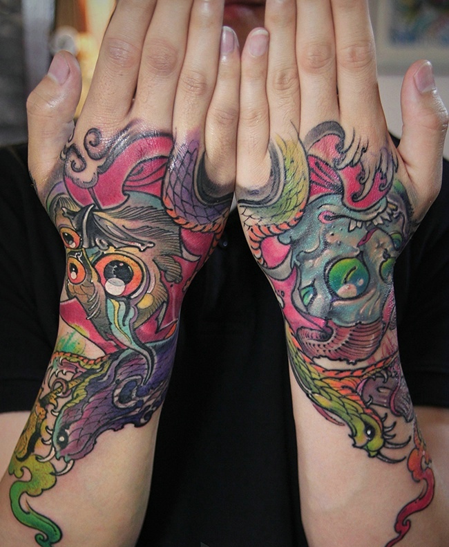 点击大图看下一张：双手臂耐看型的彩色图腾纹身刺青