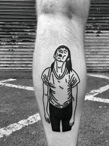 腿部一位已颓废的男士纹身图案