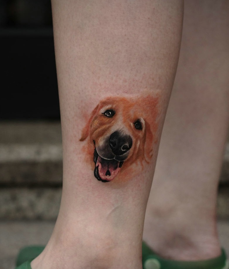 点击大图看下一张：小腿外侧十分可爱的小狗头像纹身刺青