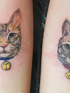 一对可爱小猫头像情侣手臂纹身图案