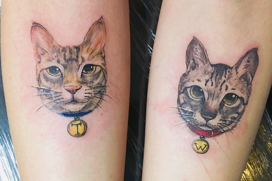 点击大图看下一张：一对可爱小猫头像情侣手臂纹身图案