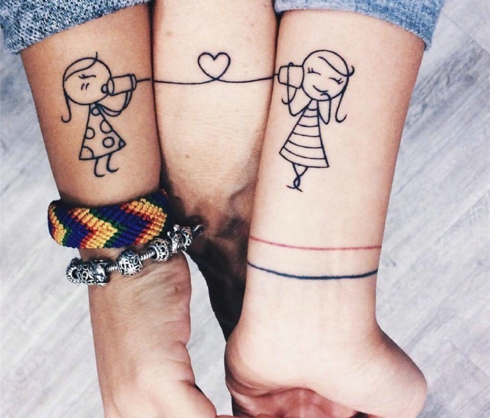 点击大图看下一张：一款非常有爱的手臂情侣纹身图案